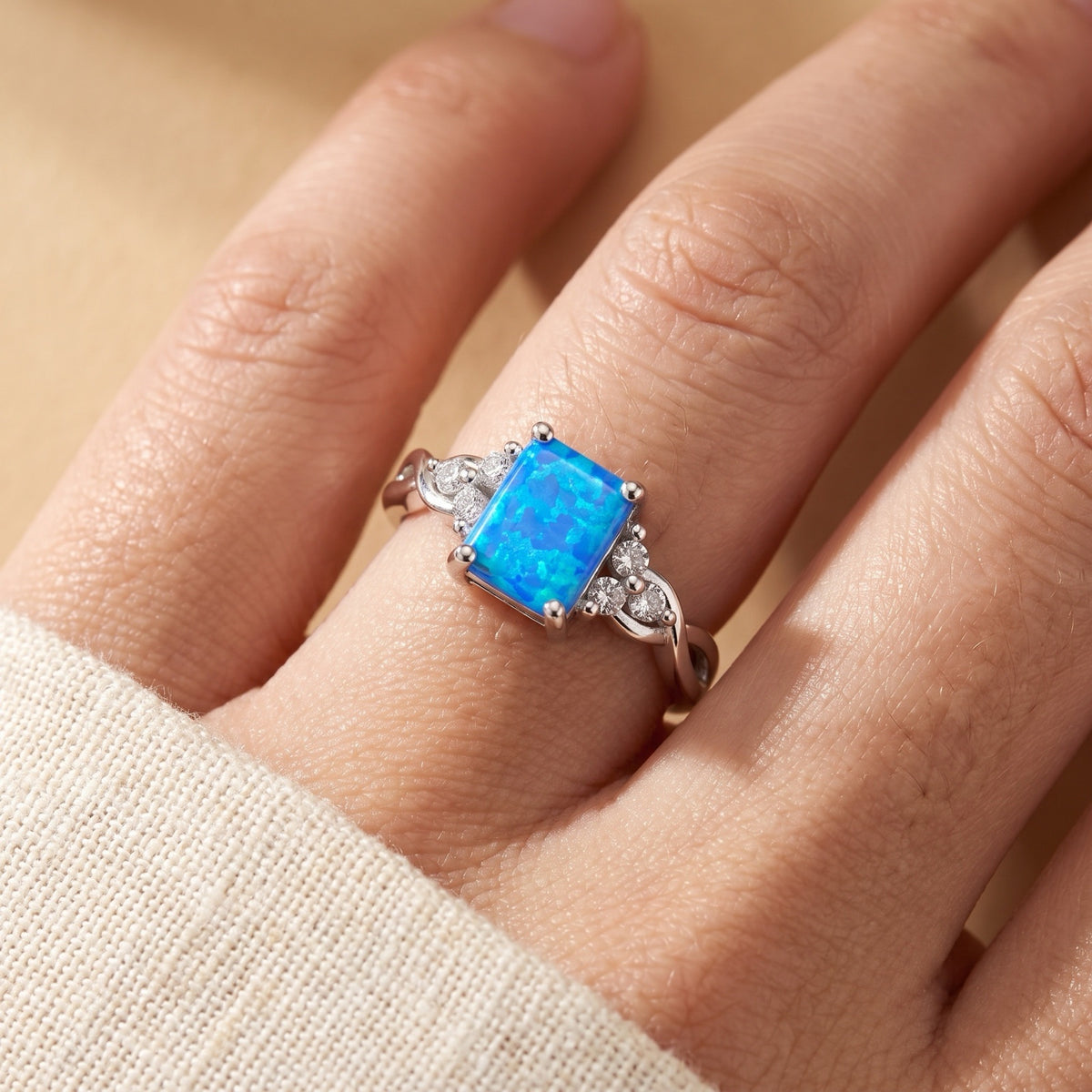 Blue Lab Opal Rectangle Infinity Knot Ring worn