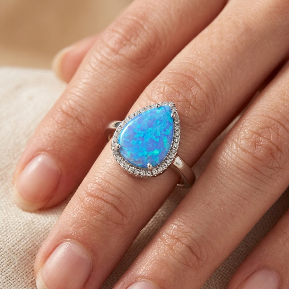 Blue Lab Opal Studded Halo Teardrop Ring worn