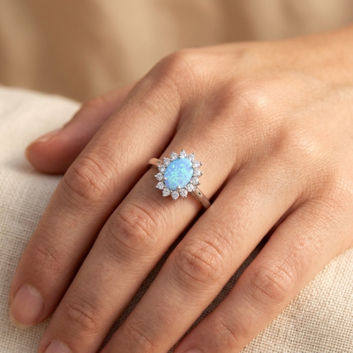 Clear CZ Oval Blue Lab Opal Halo Ring worn