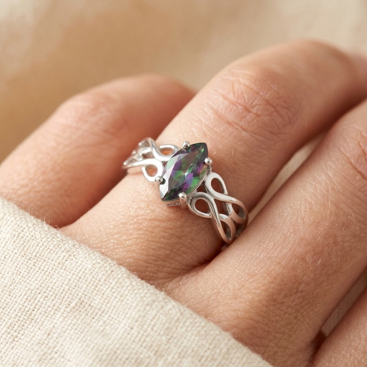 Rainbow Topaz CZ Celtic Infinity Ring worn