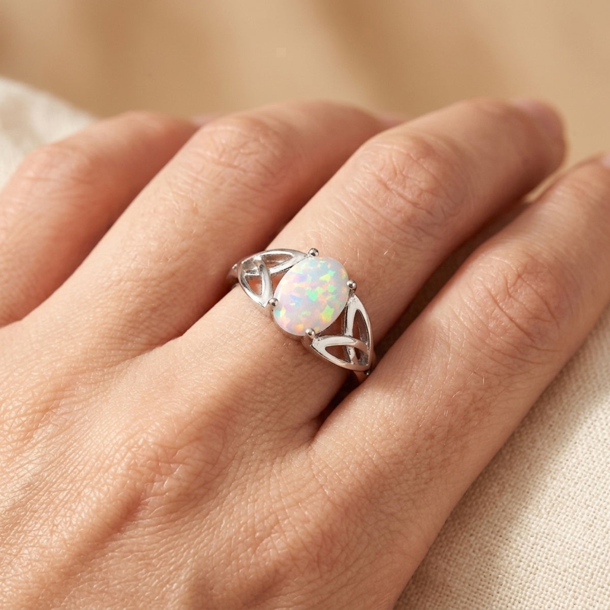 Solitaire White Lab Opal Celtic Knot Ring worn