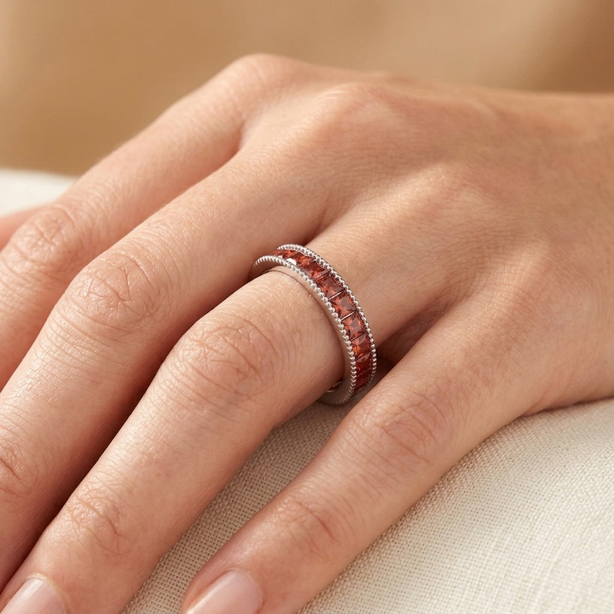 Stackable Eternity Garnet CZ Ring worn