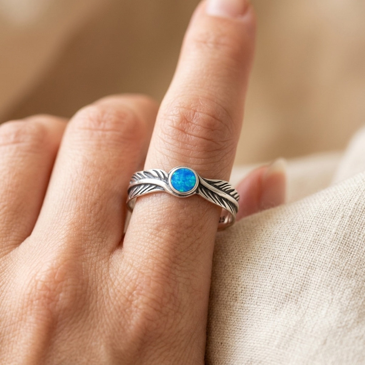 Blue Lab Opal Feather Ring worn