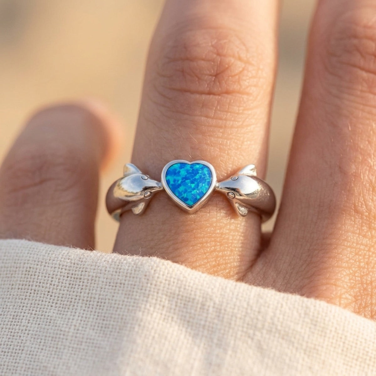 Blue Lab Opal Heart Dolphin Ring worn