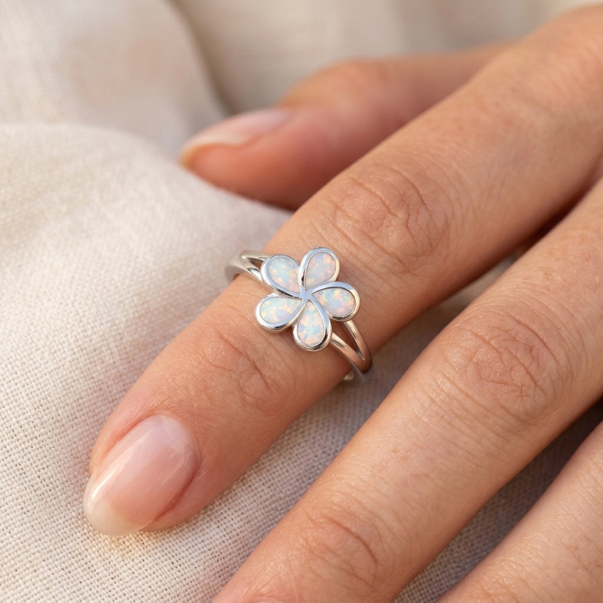 White Lab Opal Plumeria Flower Ring worn