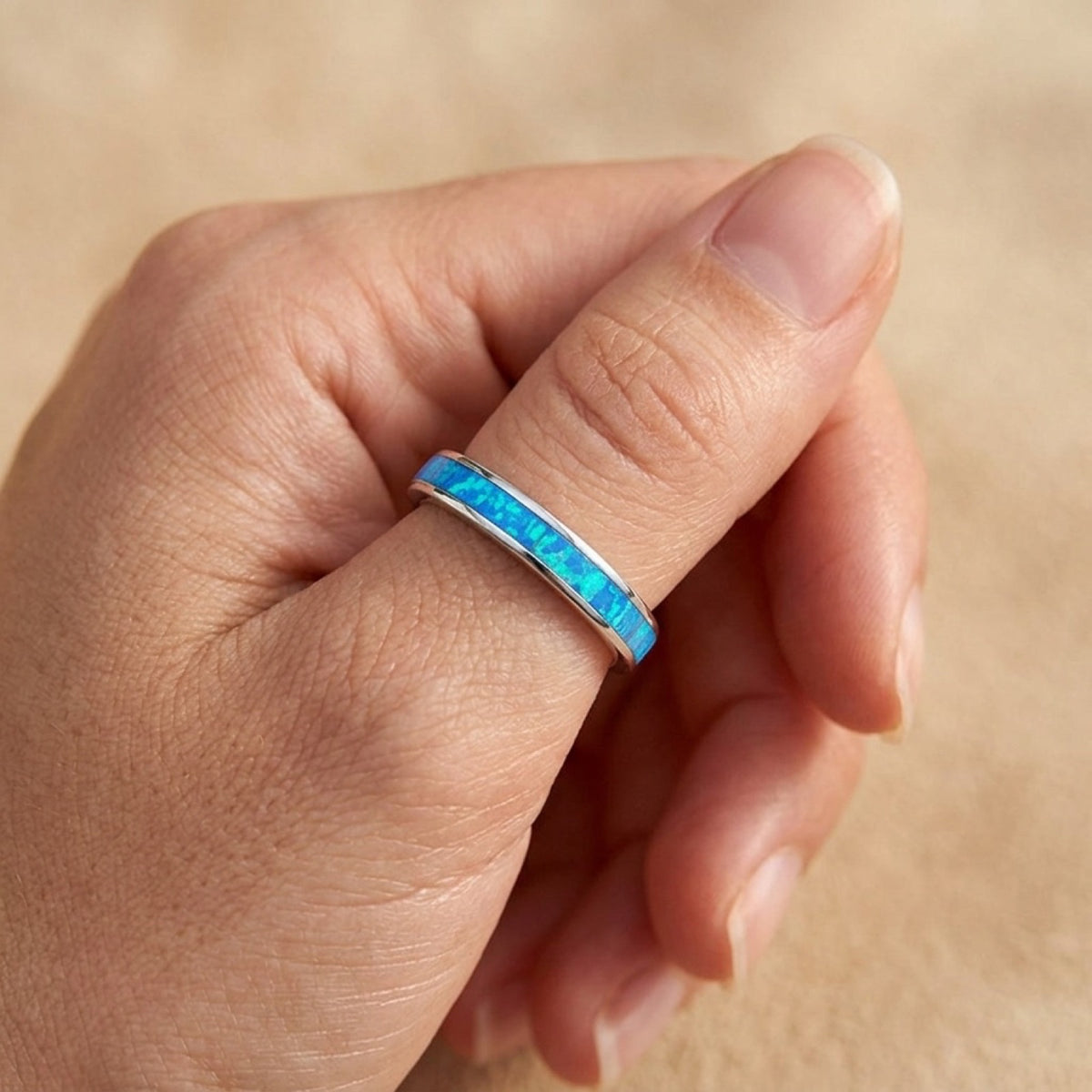 Blue Lab Opal Thumb Wedding Ring worn