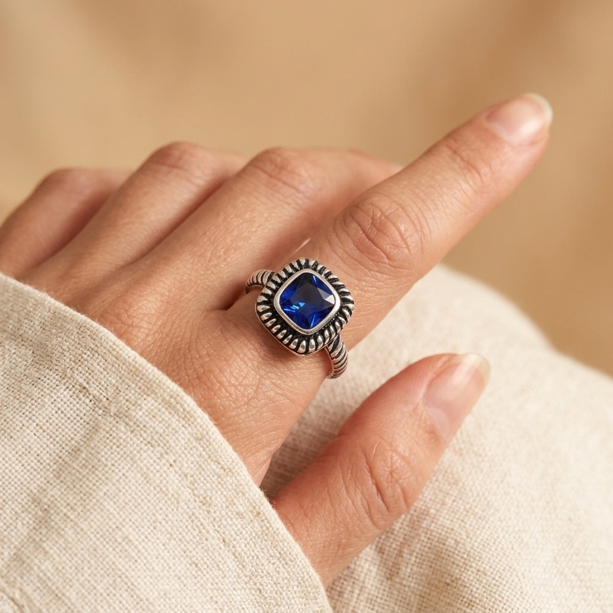 Blue Sapphire CZ Solitaire Bezel Ring worn
