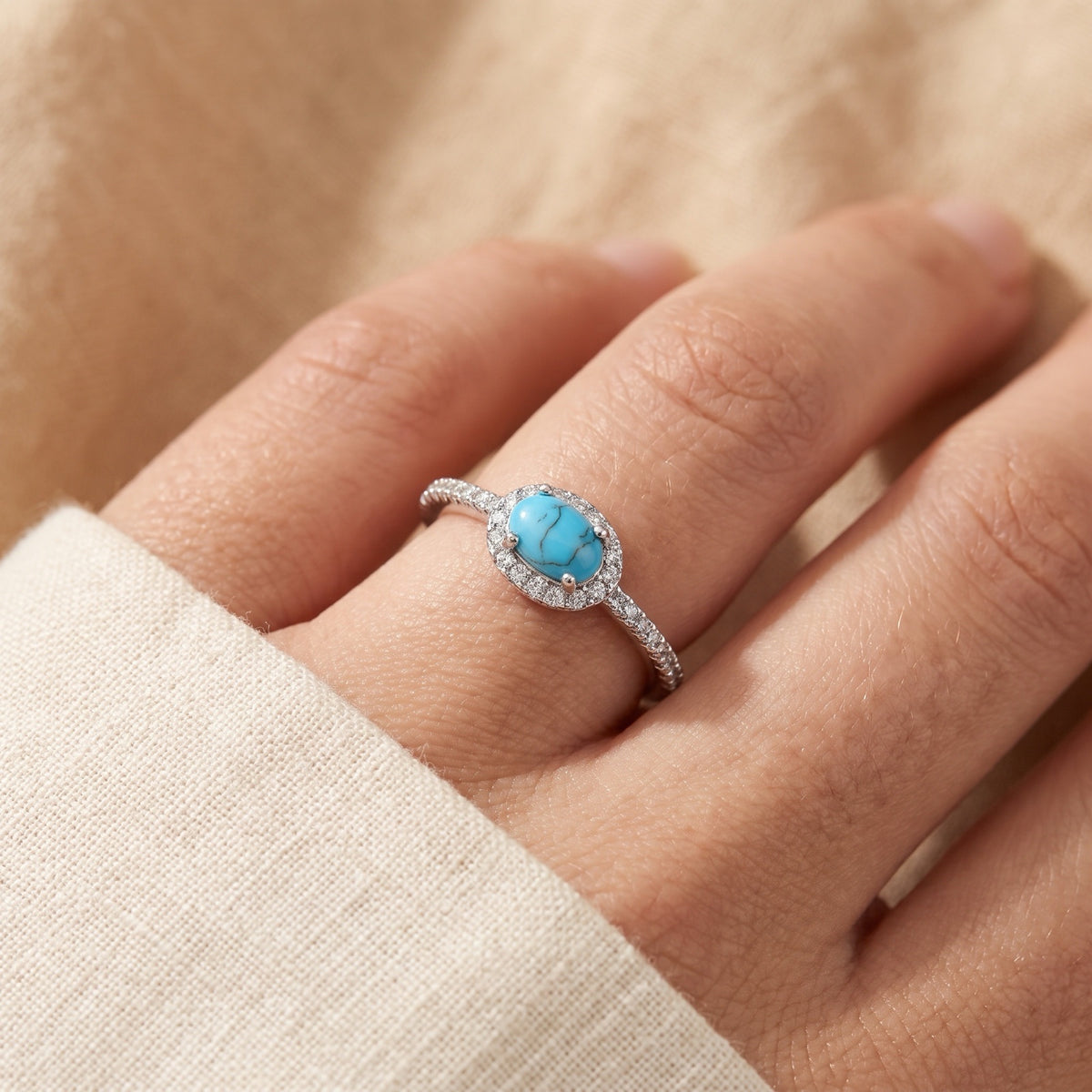 Clear CZ Turquoise Sideways Halo Oval Ring worn