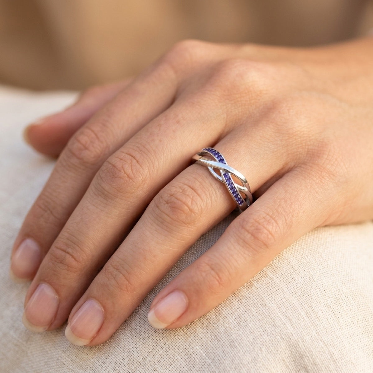 Infinity Knot Amethyst CZ Promise Ring worn