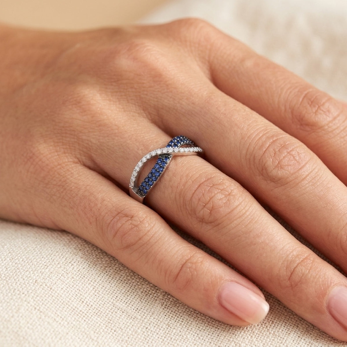 Infinity Knot Blue Sapphire CZ Micro Pave Ring worn