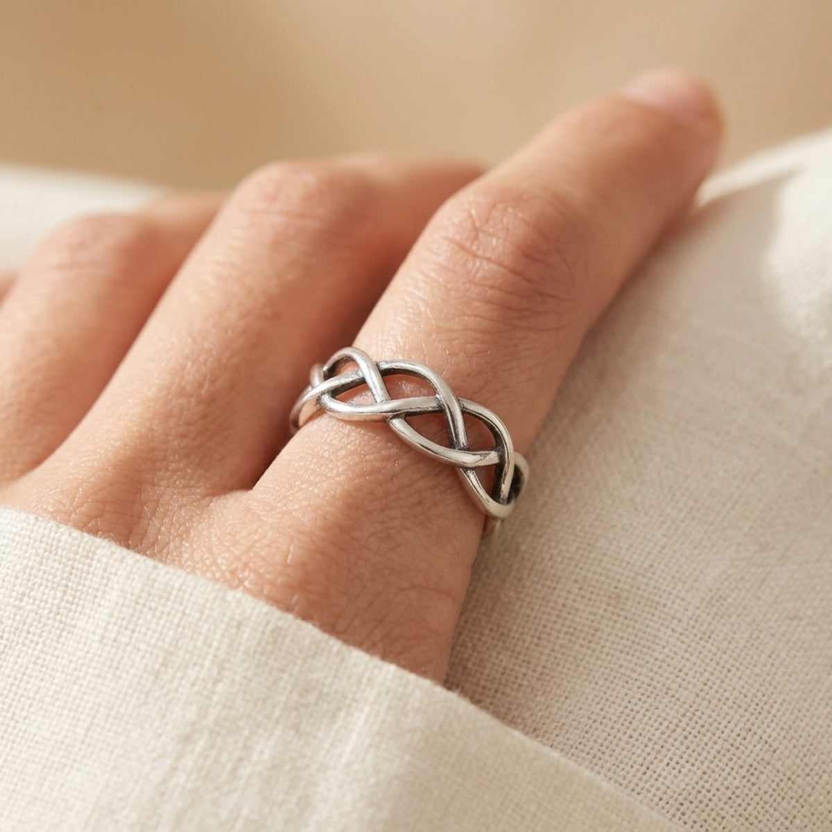 Oxidized Filigree Infinity Knot Wedding Ring worn
