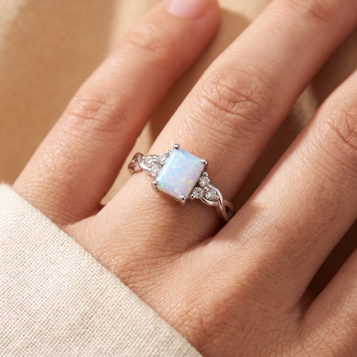 Rectangle White Lab Opal Infinity Knot Ring worn