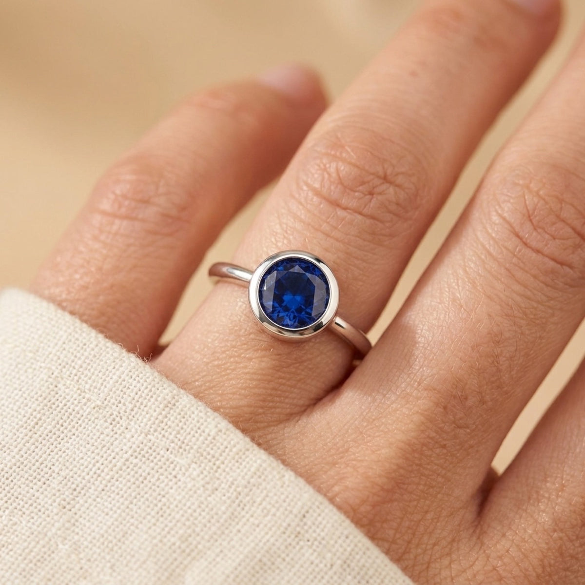 Solitaire Blue Sapphire Bezel Wedding Ring worn