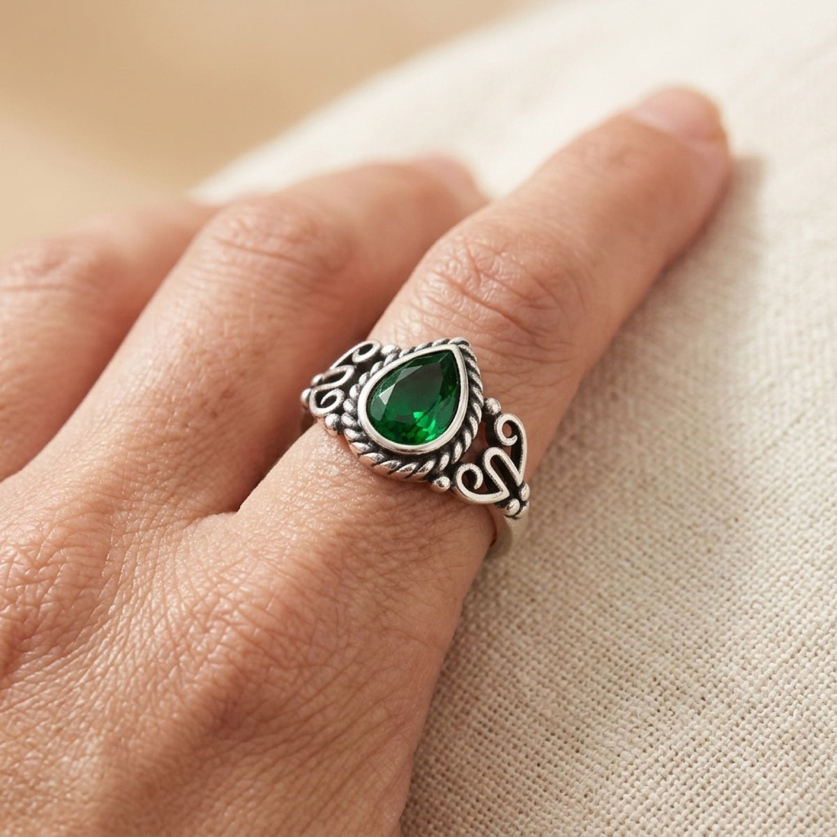 Bali Style Oxidized With Braiding & Emerald CZ Ring worn