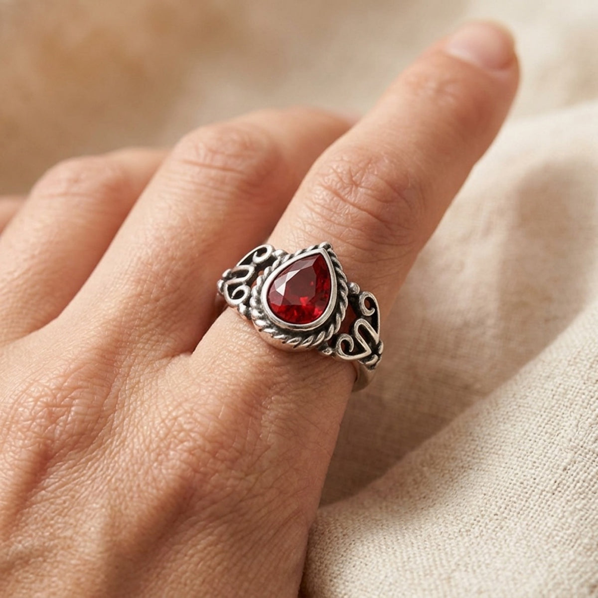 Bali Style Oxidized With Braiding & Garnet CZ Ring worn