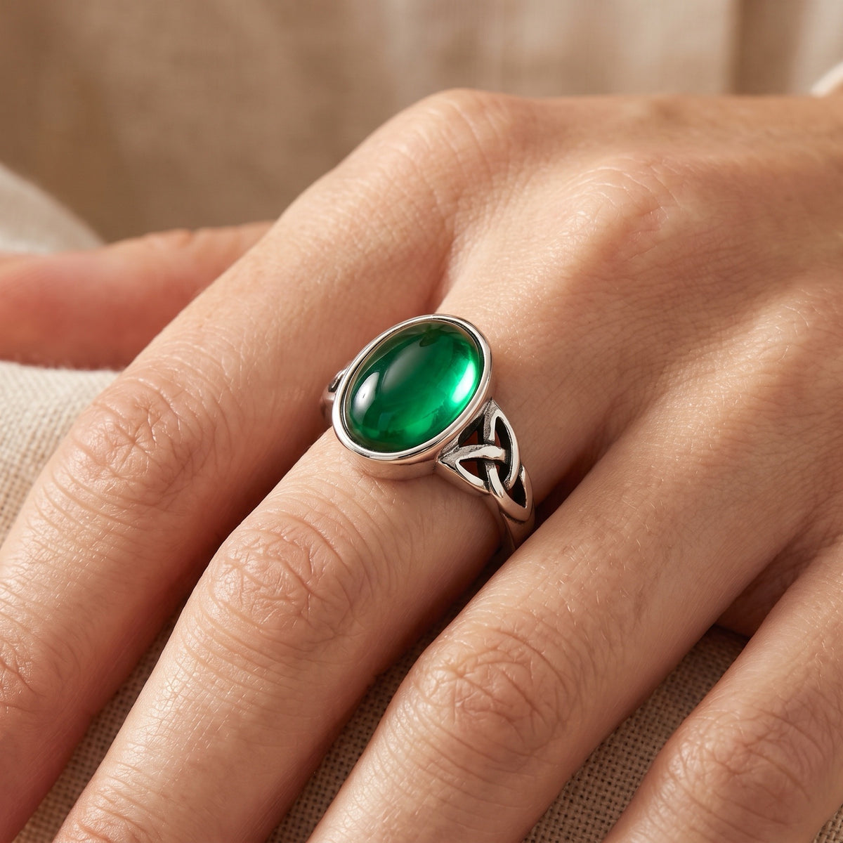 Oval Emerald CZ Cabochon With Double Triquetras Ring worn