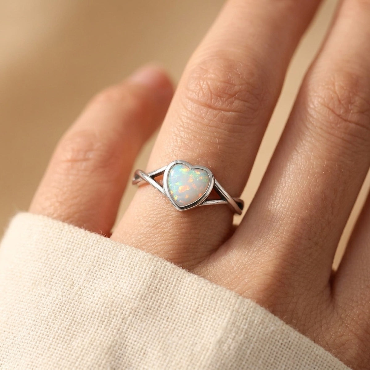 Infinity Heart White Lab Opal Ring worn