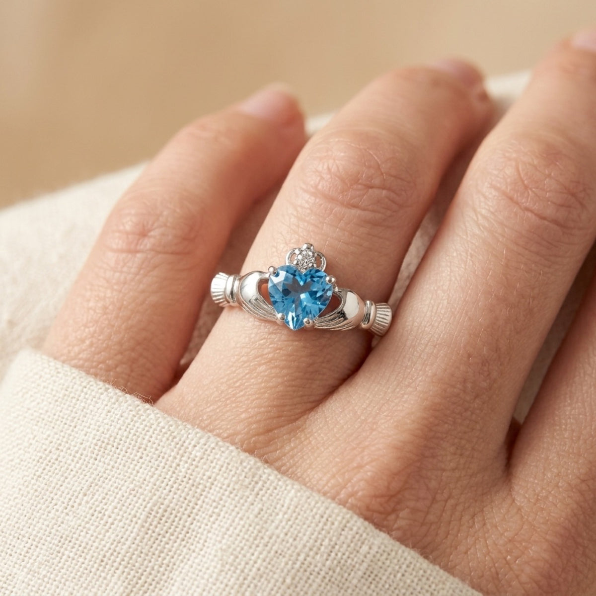 Woman's Aquamarine CZ Irish Claddagh Ring worn