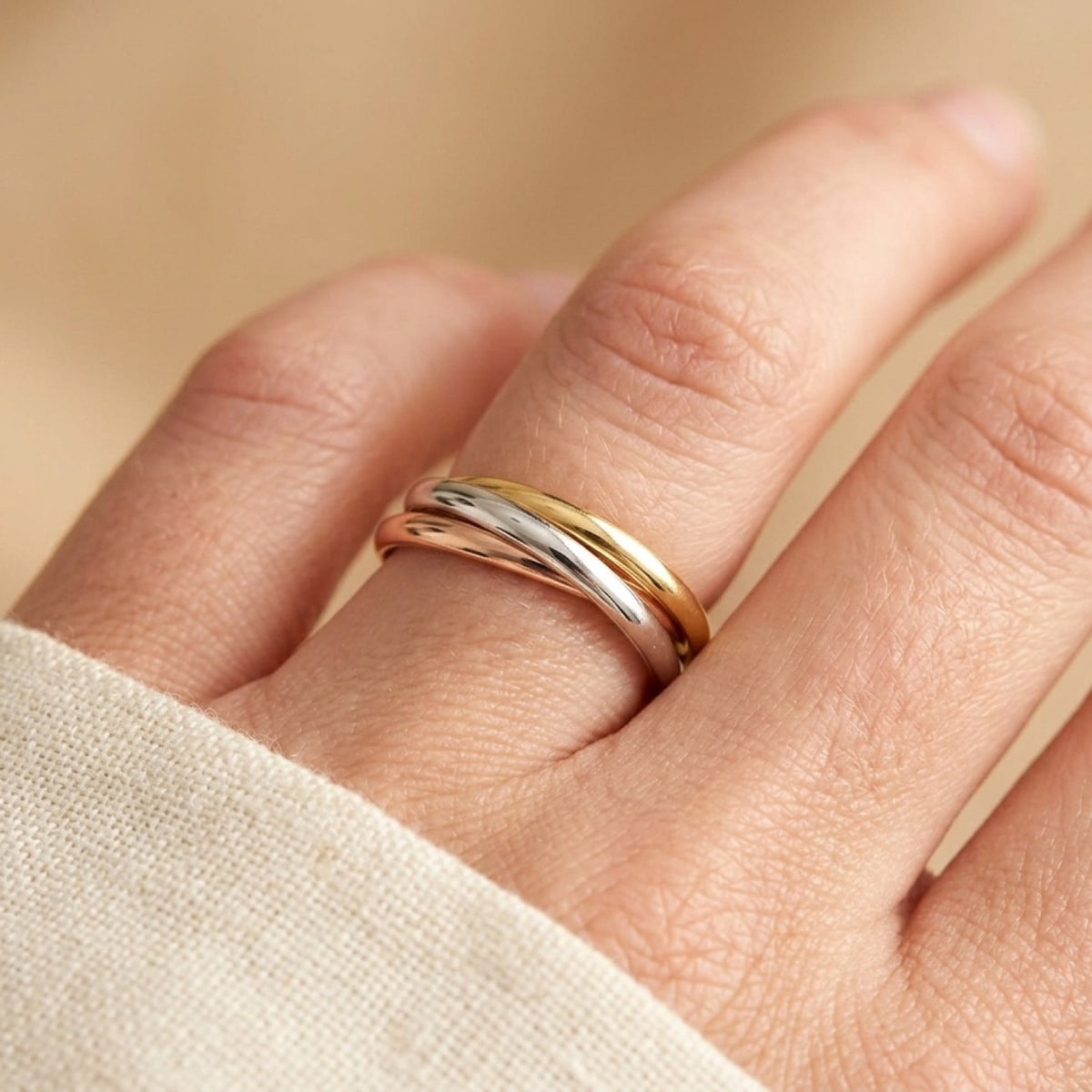 Thin Rose Gold Tone Rolling Wedding Ring worn
