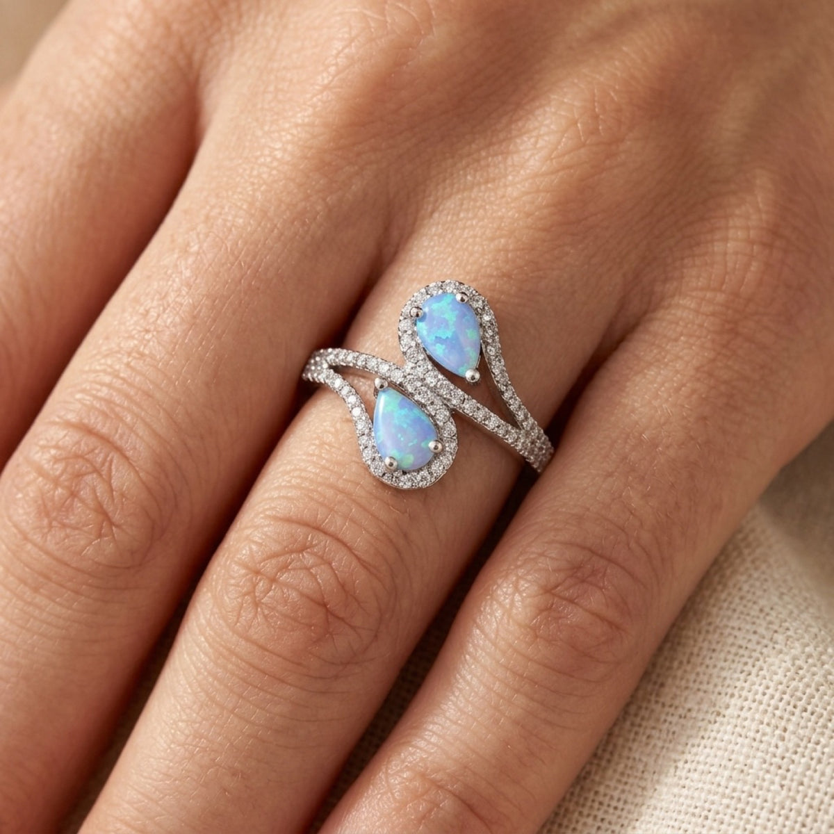 White CZ Blue Lab Opal Teardrop Halo Ring worn
